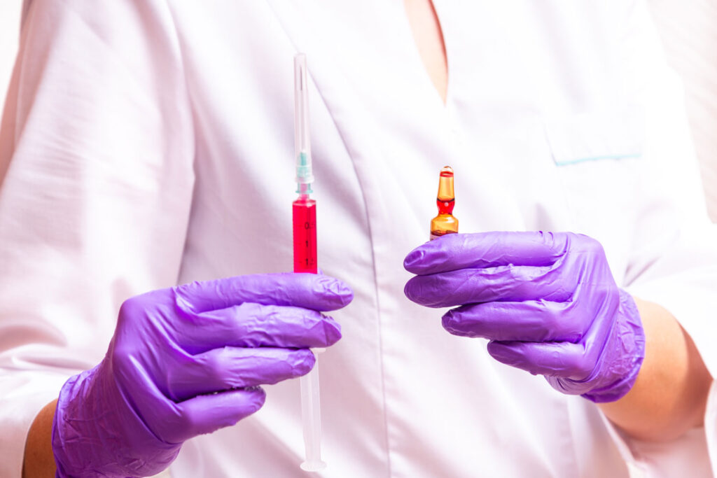 B12 injection being prepared by a healthcare provider for vitamin therapy